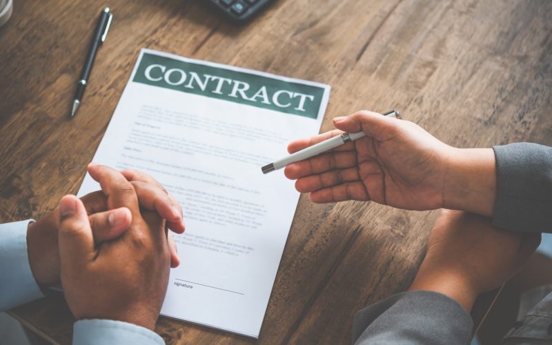 businessman is negotiating, advising, and explaining the matter of the contract to be agreed to sign the contract.